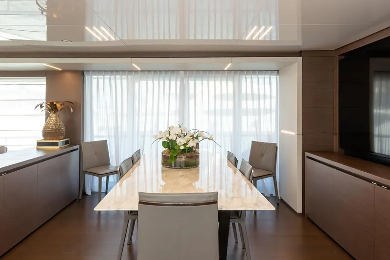 Willpower Yacht Photos Pics Luxurious dining area on 2018 FERETTI Navetta 37 yacht with elegant decor and natural light.
