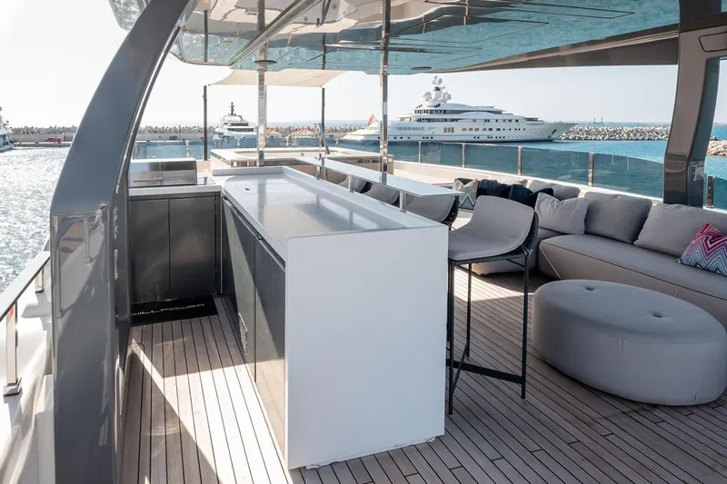 Willpower Yacht Photos Pics Luxurious 2018 FERETTI Navetta 37 yacht deck with modern seating and ocean view.