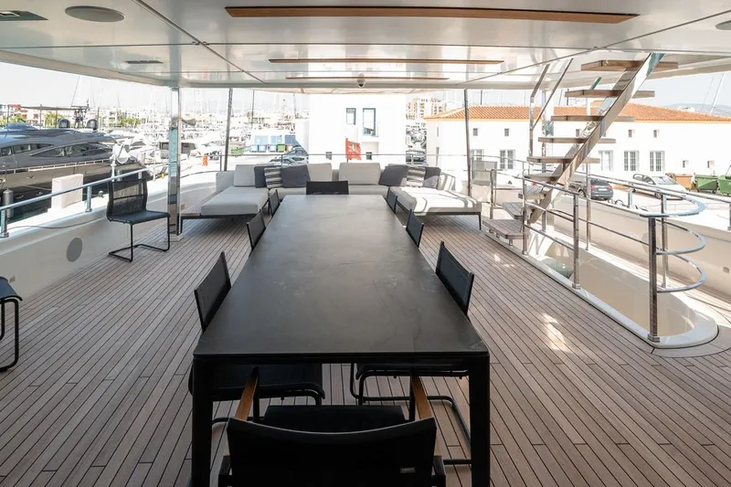 Willpower Yacht Photos Pics Spacious deck of 2018 FERETTI Navetta 37 yacht with seating and dining area.