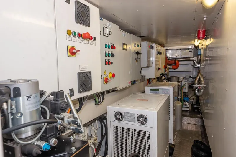 Willpower Yacht Photos Pics Engine room of 2018 FERETTI Navetta 37 yacht with control panels and machinery.