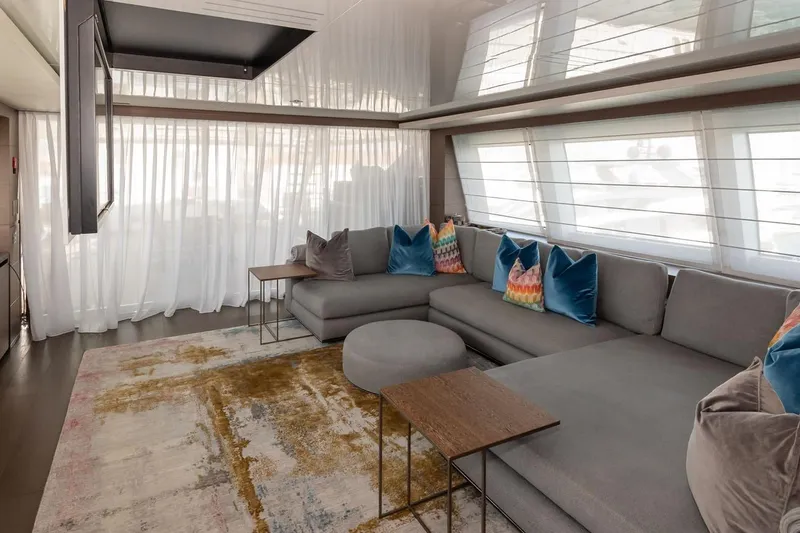 Willpower Yacht Photos Pics Luxurious 2018 FERETTI Navetta 37 yacht interior with modern seating and vibrant cushions.