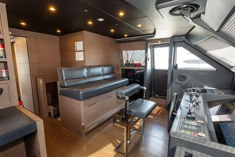 Willpower Yacht Photos Pics Luxurious interior of 2018 FERETTI Navetta 37 yacht with modern helm and seating.