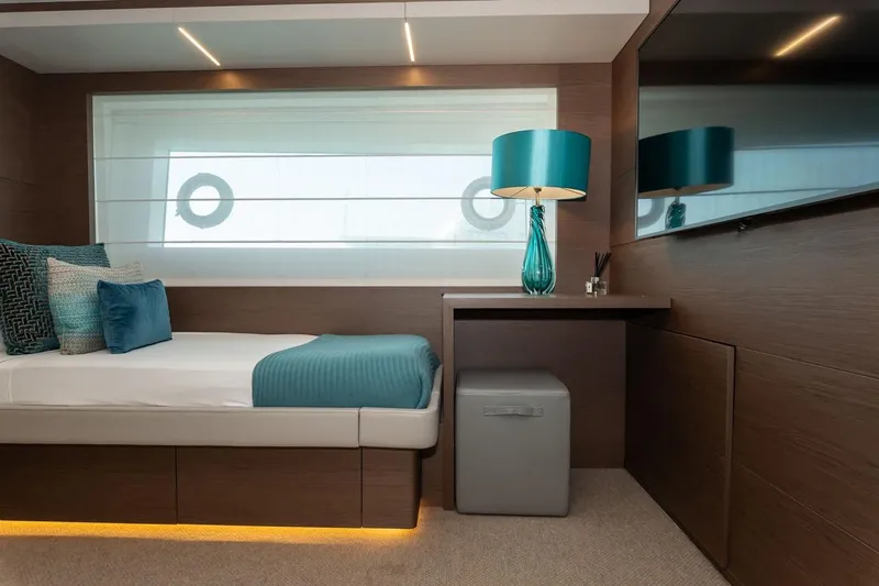 Willpower Yacht Photos Pics Luxurious cabin interior of 2018 FERETTI Navetta 37 yacht with modern decor and ambient lighting.