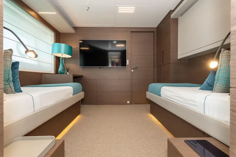 Willpower Yacht Photos Pics Luxurious 2018 FERETTI Navetta 37 yacht cabin with twin beds and modern decor.