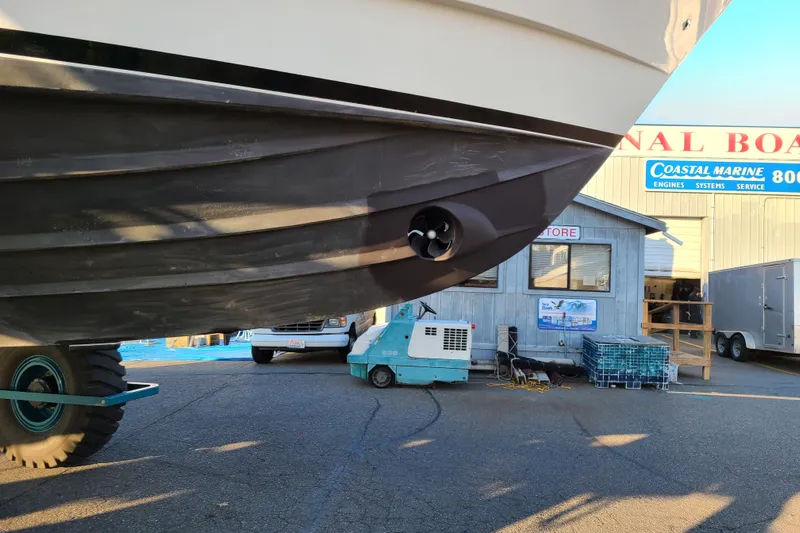 Outbound Yacht Photos Pics 1993 Symbol 55 Yachtfisher on trailer at Coastal Marine service area.