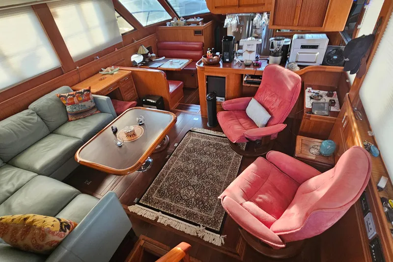 Outbound Yacht Photos Pics Luxurious interior of a 1993 Symbol 55 Yachtfisher with plush seating and elegant decor.