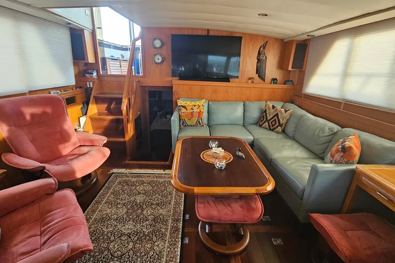 Outbound Yacht Photos Pics Luxurious 1993 Symbol 55 Yachtfisher interior with cozy seating and elegant decor.
