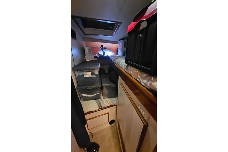 Outbound Yacht Photos Pics Interior cabin of 1993 Symbol 55 Yachtfisher with storage and bedding.