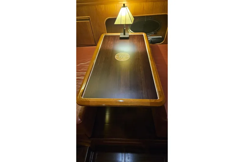 Outbound Yacht Photos Pics Luxurious wooden table with lamp on 1993 Symbol 55 Yachtfisher.