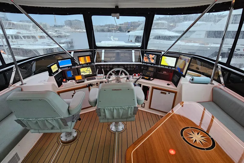 Outbound Yacht Photos Pics Cockpit of a 1993 Symbol Yacht Fisher/Motor Yacht with navigation equipment and seating.