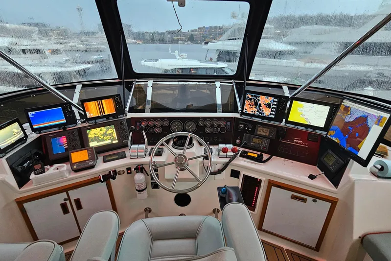 Outbound Yacht Photos Pics Cockpit of a 1993 Symbol Yacht Fisher/Motor Yacht with navigation equipment.