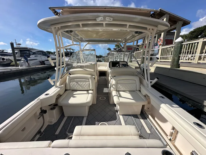  Yacht Photos Pics 2022 Grady-White Freedom 285 boat interior at marina, featuring spacious seating and modern design.
