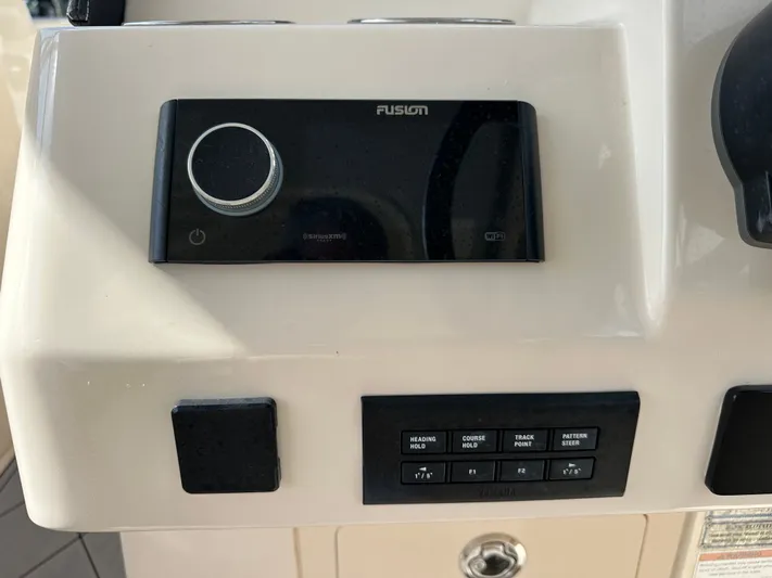  Yacht Photos Pics Control panel of 2022 Grady-White Freedom 285 boat with Fusion audio system.