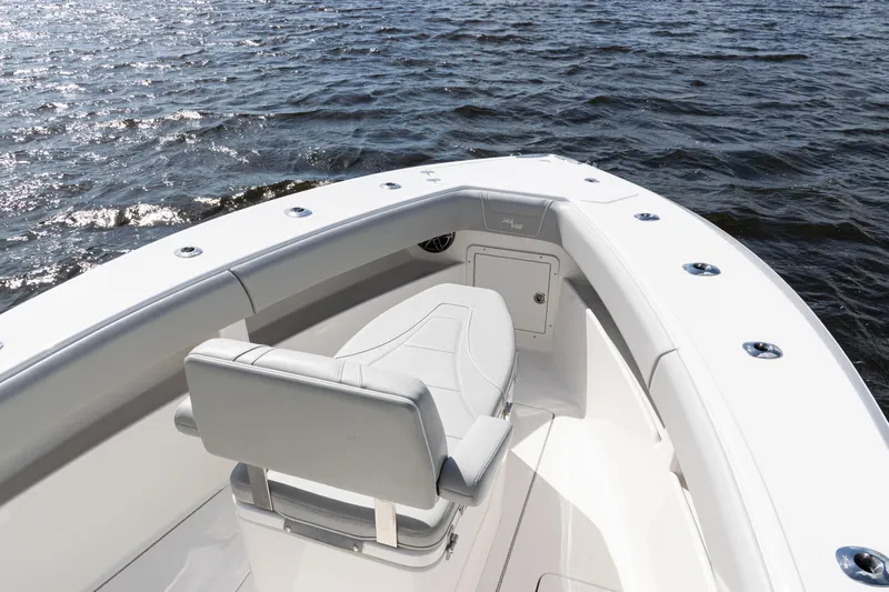  Yacht Photos Pics 2024 SeaVee 290B boat with sleek seating, cruising on open water.