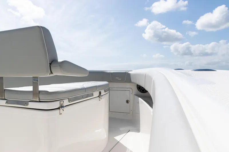  Yacht Photos Pics 2024 SeaVee 290B boat interior with seating, under a clear blue sky.