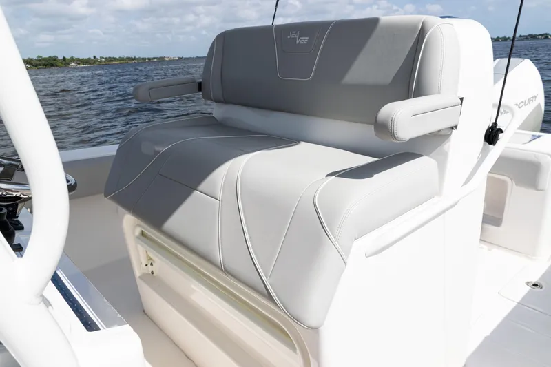  Yacht Photos Pics 2024 SeaVee 290B boat with comfortable seating, featuring sleek gray upholstery.