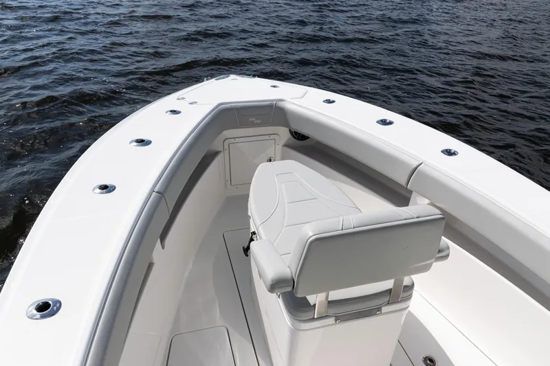  Yacht Photos Pics 2024 SeaVee 290B boat bow with seating, on calm water.