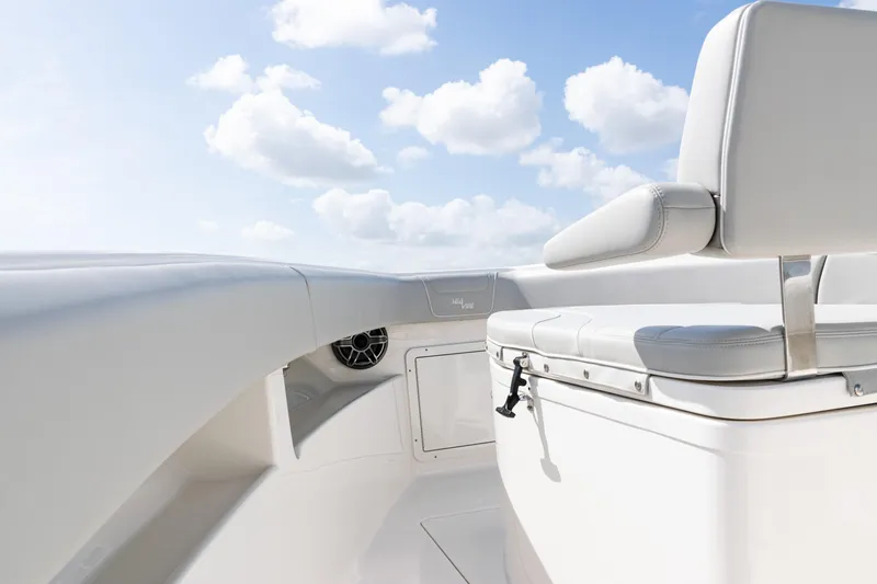  Yacht Photos Pics 2024 SeaVee 290B boat interior with white seating and clear blue sky.