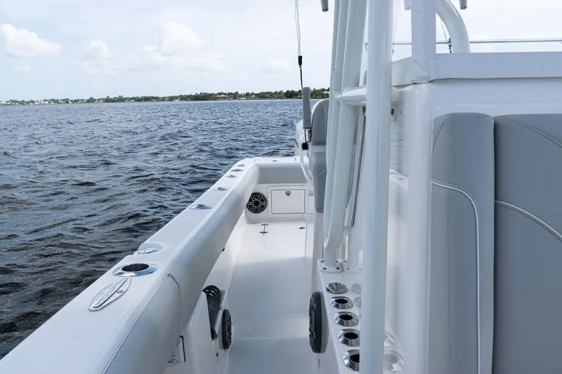  Yacht Photos Pics 2024 SeaVee 290B boat, sleek design, spacious deck, on calm waters.