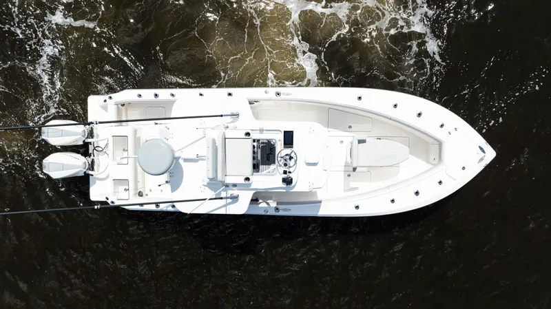  Yacht Photos Pics Aerial view of 2024 SeaVee 290B boat navigating through dark waters.