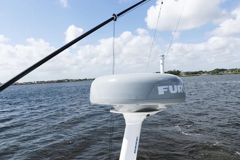  Yacht Photos Pics 2024 SeaVee 290B boat with Furuno radar on open water under cloudy sky.