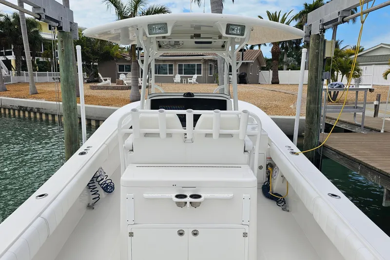 Redemption Yacht Photos Pics 2012 Regulator 34SS boat docked, featuring spacious deck and seating area.