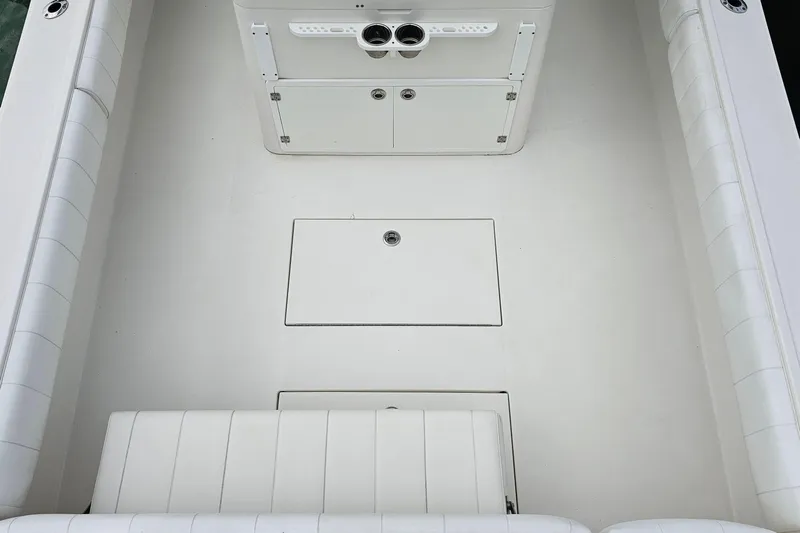 Redemption Yacht Photos Pics 2012 Regulator 34SS boat interior with white seating and storage compartments.