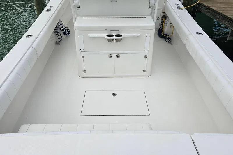 Redemption Yacht Photos Pics 2012 Regulator 34SS boat interior with white seating and storage compartments.