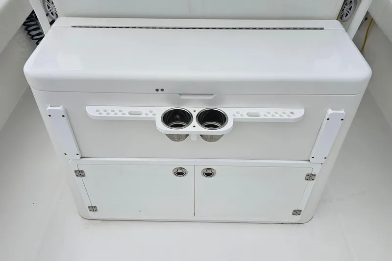 Redemption Yacht Photos Pics 2012 Regulator 34SS boat console with cup holders and storage compartments.