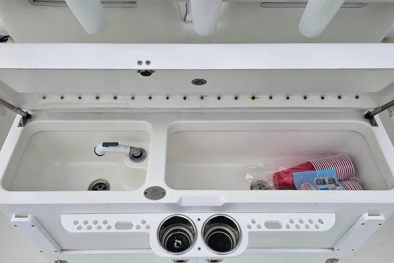 Redemption Yacht Photos Pics 2012 Regulator 34SS boat sink with faucet and storage compartment.