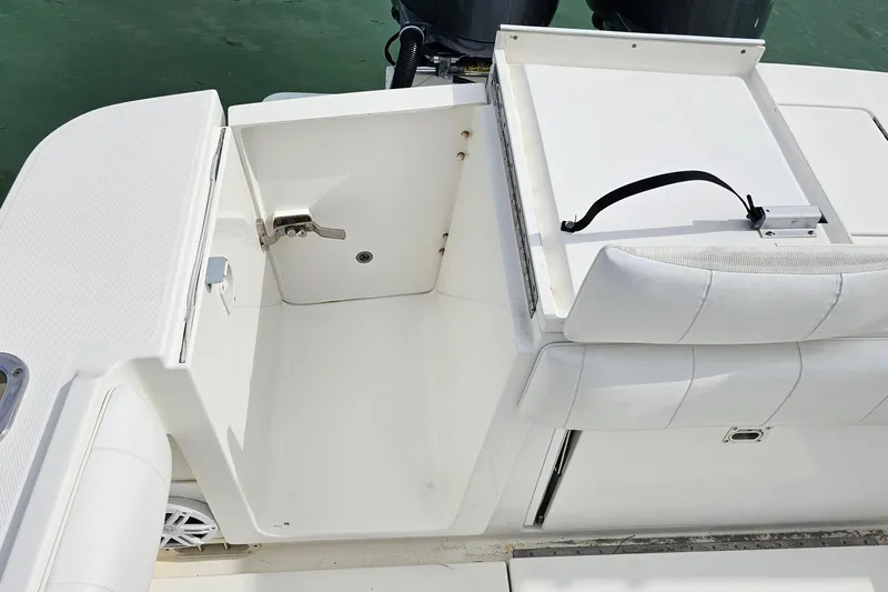 Redemption Yacht Photos Pics 2012 Regulator 34SS boat interior with storage compartment and seating.