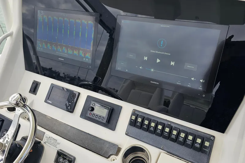 Redemption Yacht Photos Pics Control panel of a 2012 Regulator 34SS boat with Garmin displays.