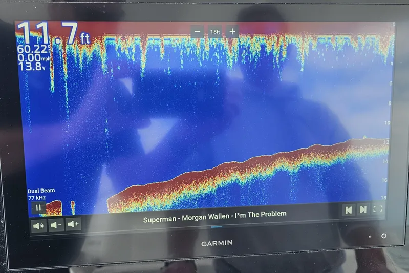 Redemption Yacht Photos Pics Garmin sonar display on 2012 Regulator 34SS, showing depth and music track.
