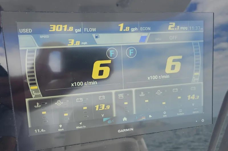 Redemption Yacht Photos Pics Garmin display on 2012 Regulator 34SS showing fuel usage and engine metrics.