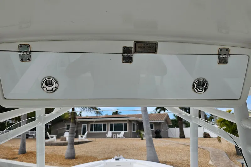 Redemption Yacht Photos Pics 2012 Regulator 34SS boat storage compartment with latches, tropical background.