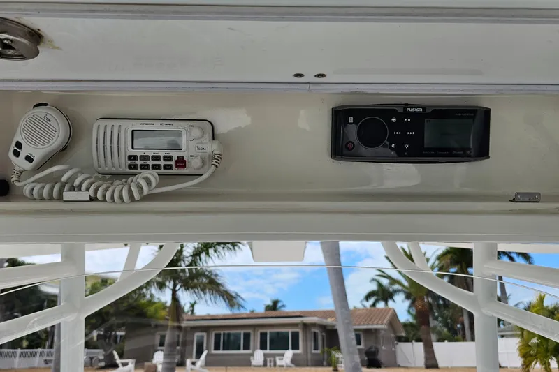 Redemption Yacht Photos Pics 2012 Regulator 34SS boat electronics, featuring a VHF marine radio and Fusion stereo system.