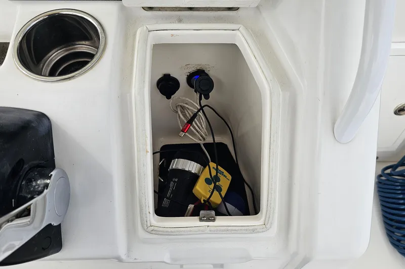 Redemption Yacht Photos Pics Storage compartment on a 2012 Regulator 34SS boat with various equipment inside.