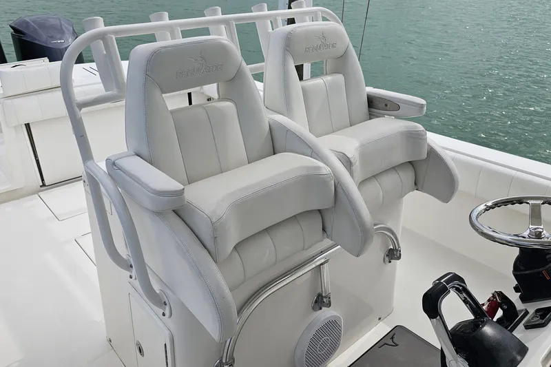 Redemption Yacht Photos Pics 2012 Regulator 34SS boat with dual white captain's chairs and steering wheel.