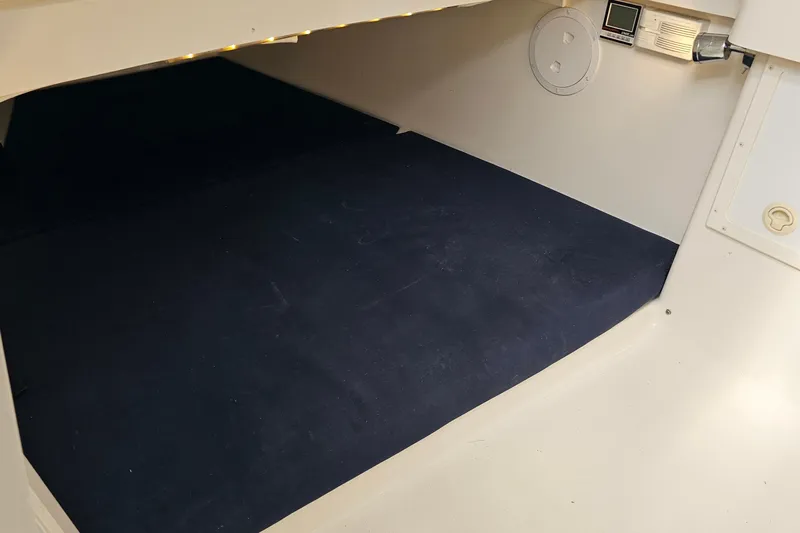 Redemption Yacht Photos Pics 2012 Regulator 34SS cabin interior with dark flooring and control panel.