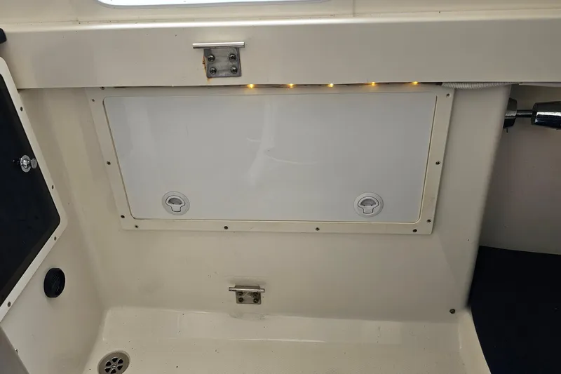 Redemption Yacht Photos Pics 2012 Regulator 34SS boat interior with storage compartment and LED lighting.