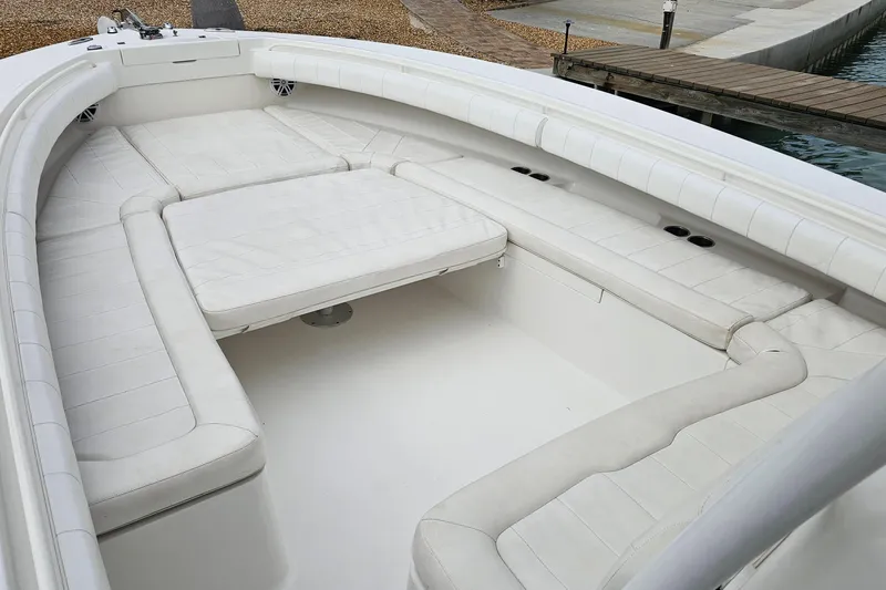 Redemption Yacht Photos Pics 2012 Regulator 34SS boat interior with white cushioned seating and spacious layout.