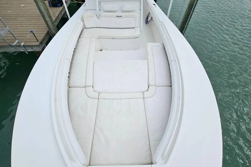 Redemption Yacht Photos Pics 2012 Regulator 34SS boat with spacious white seating area at dock.