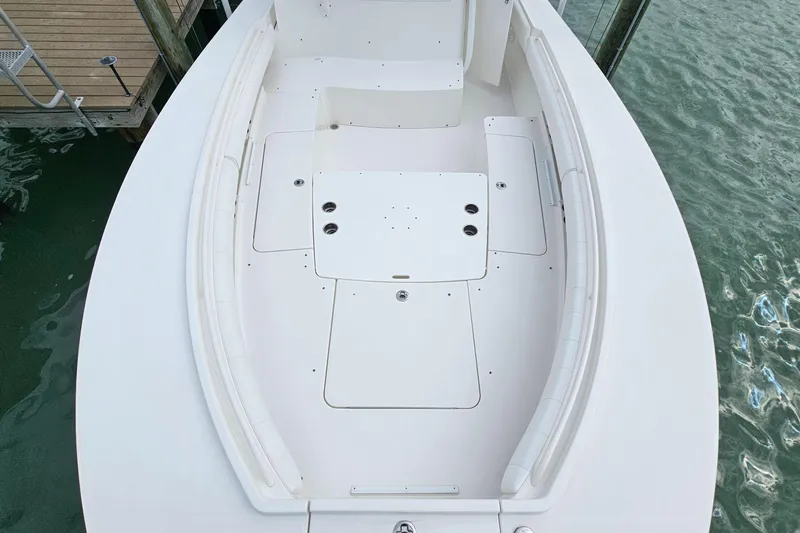 Redemption Yacht Photos Pics 2012 Regulator 34SS boat deck, white, docked on calm water.