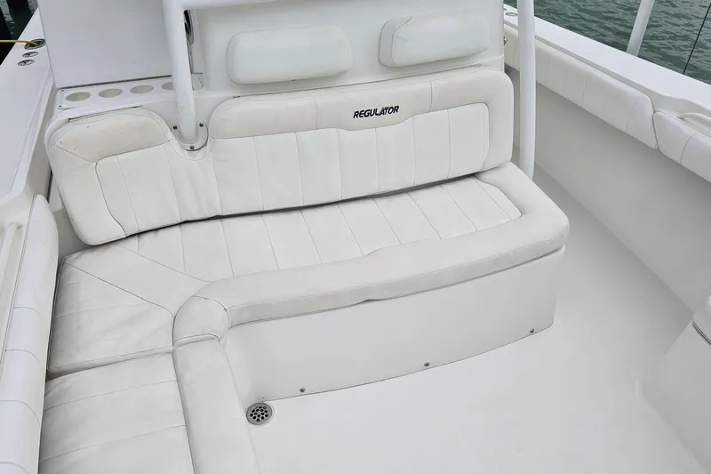Redemption Yacht Photos Pics 2012 Regulator 34SS boat with white cushioned seating and sleek design.