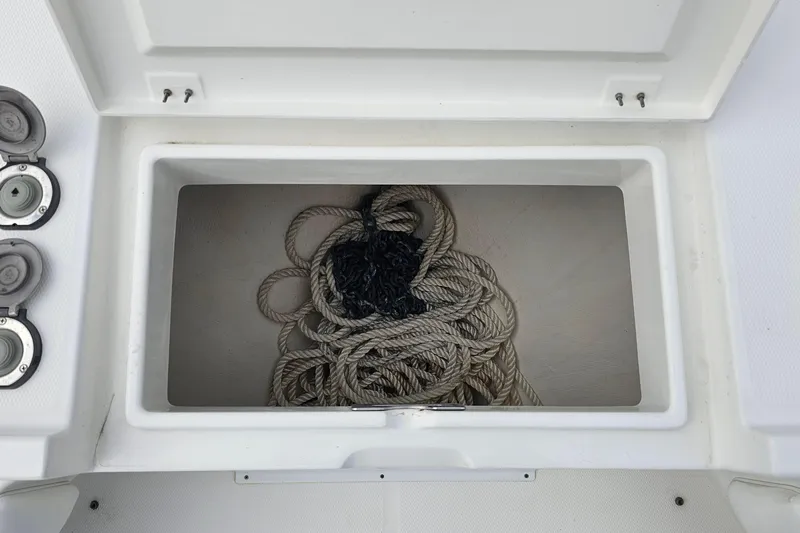 Redemption Yacht Photos Pics Storage compartment with coiled rope on a 2012 Regulator 34SS boat.