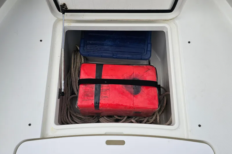 Redemption Yacht Photos Pics Storage compartment on a 2012 Regulator 34SS boat with safety gear and rope.