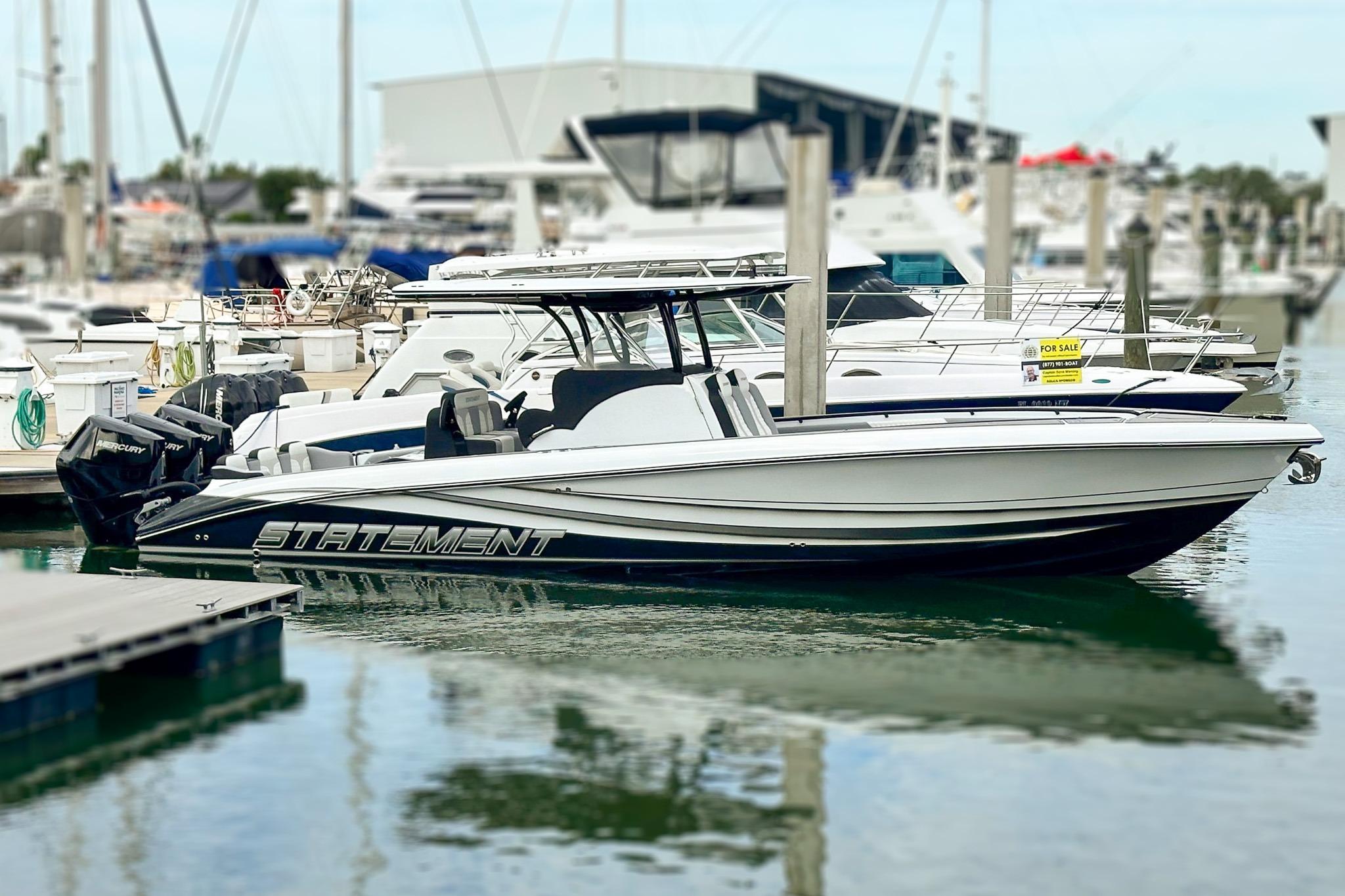 2024 Statement 350 Open boat docked at marina, sleek design, powerful engines.