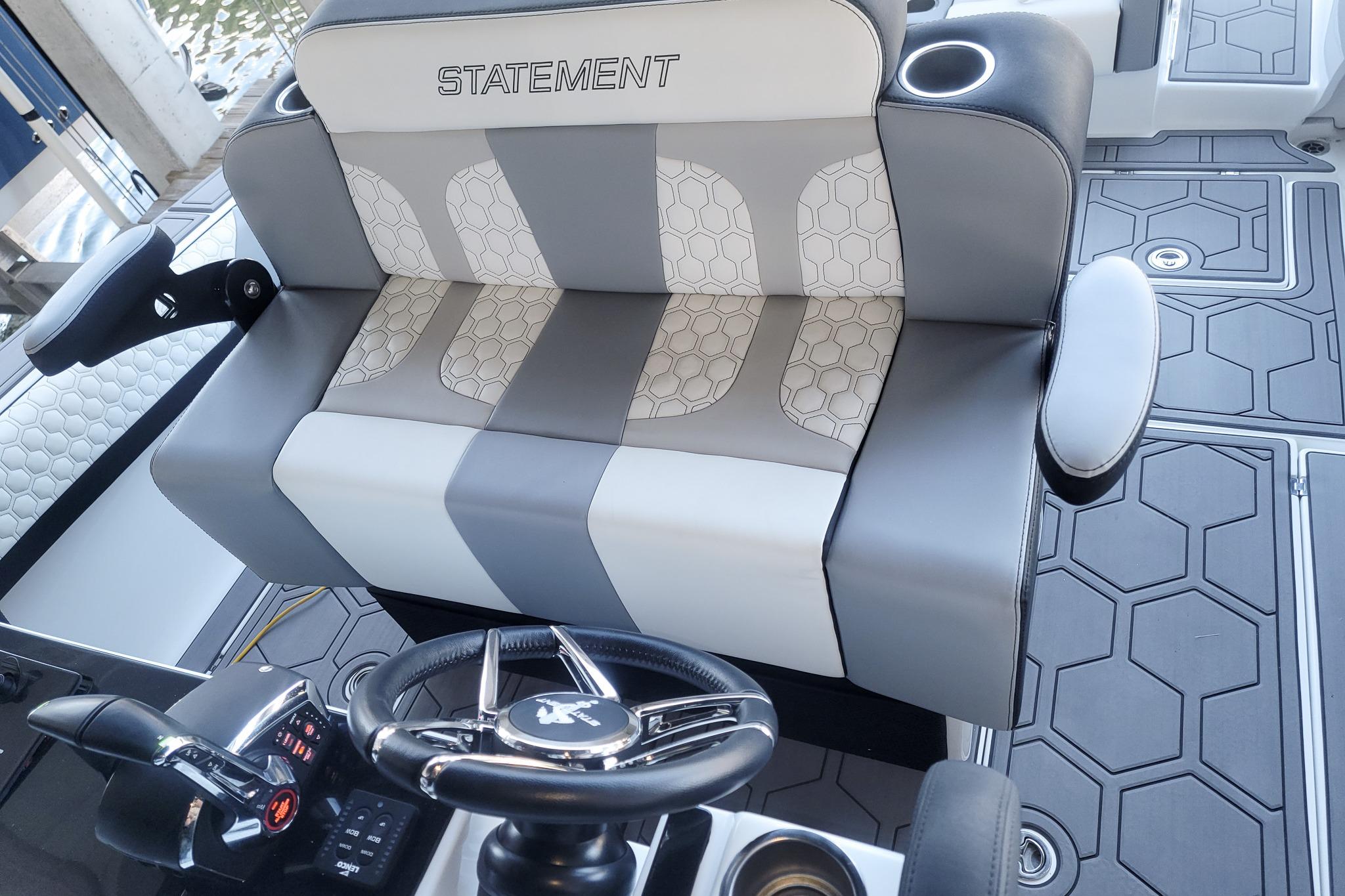 2024 Statement 350 Open boat interior with stylish seating and modern steering wheel design.