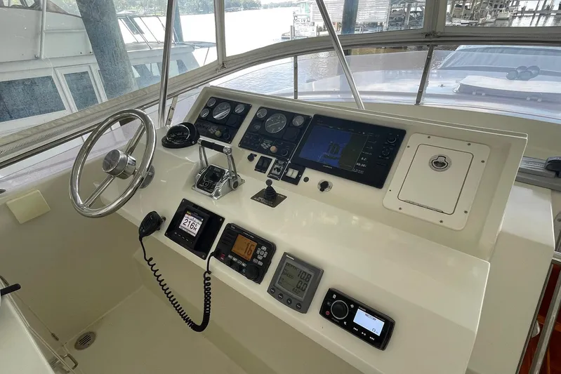 Aventis Yacht Photos Pics 1999 McKinna 57 Pilothouse helm with navigation instruments and steering wheel.