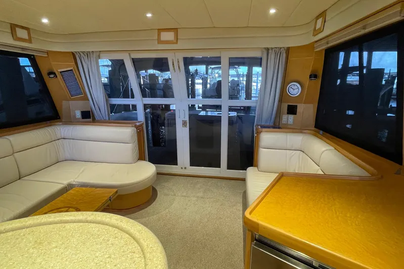 Aventis Yacht Photos Pics Luxurious interior of 1999 McKinna 57 Pilothouse yacht with plush seating and elegant design.